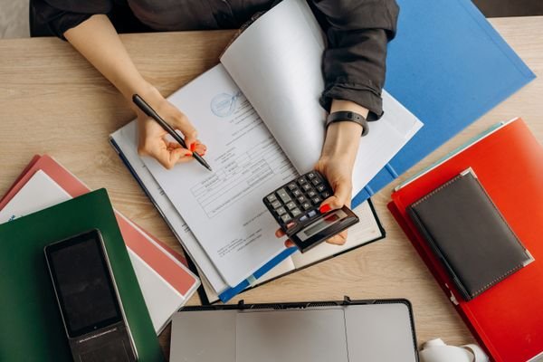 Accountant analyzing financial documents and receivables